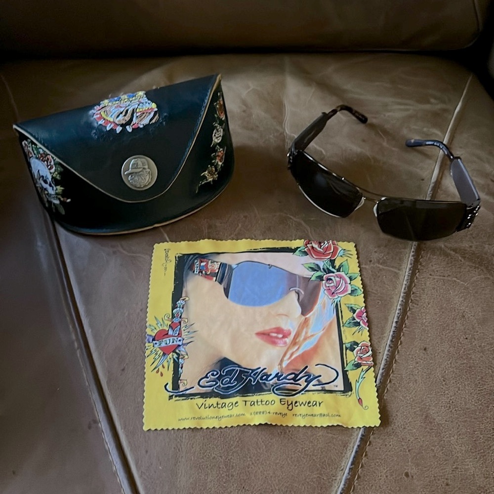 Vintage Ed Hardy Bulldog Skull sunglasses with leather case and cleaning cloth.